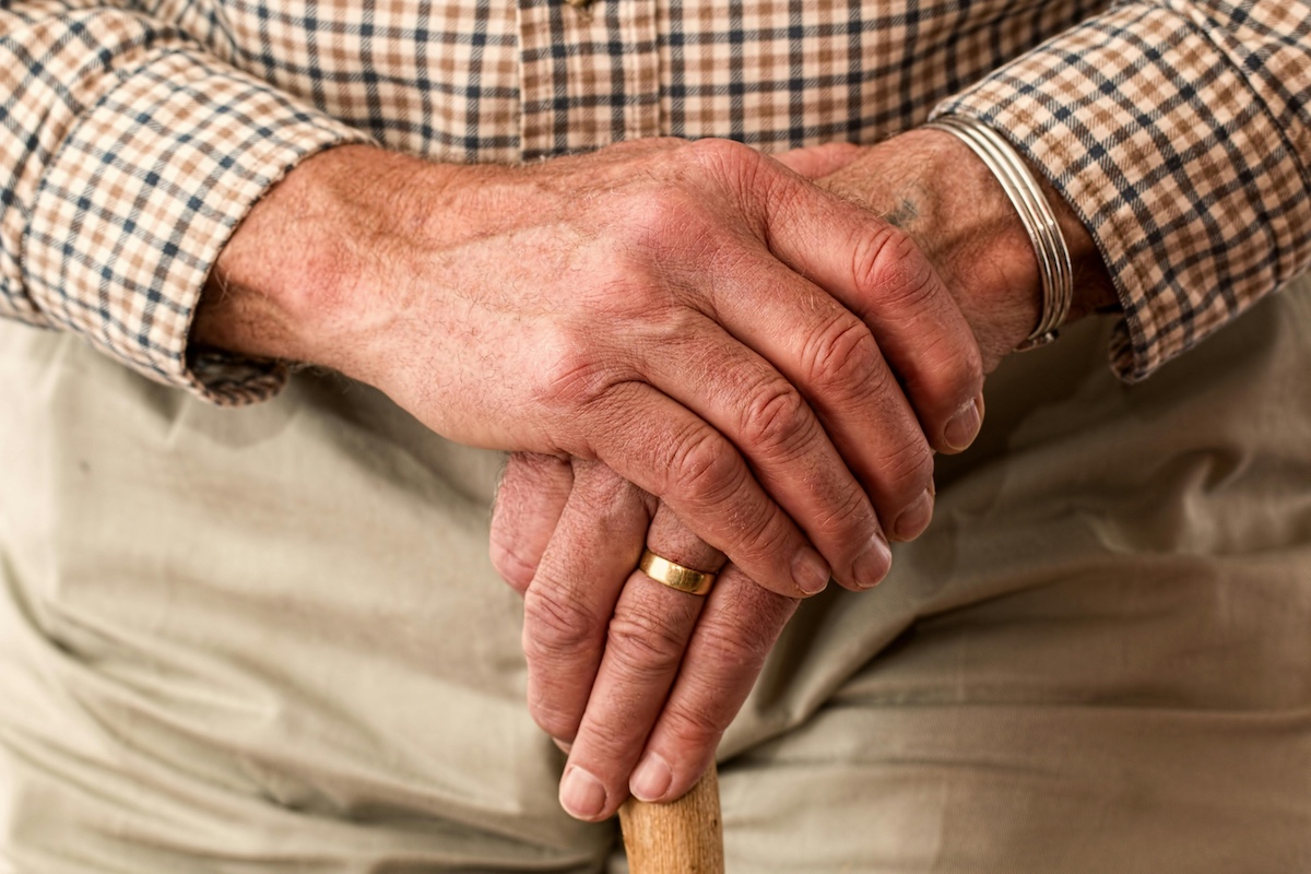 Hands of an older man.