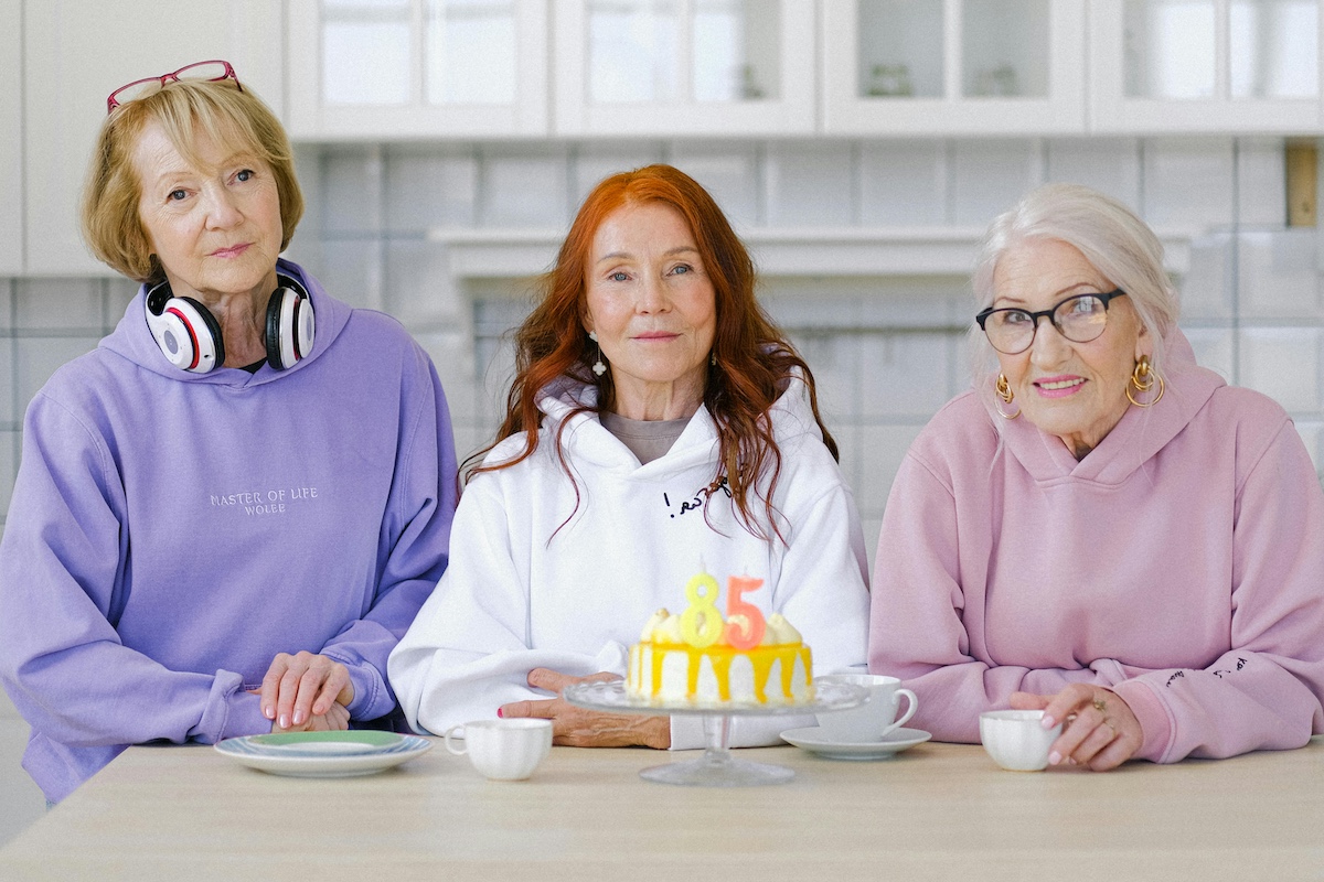 Three older ladies celebrating a birthday.